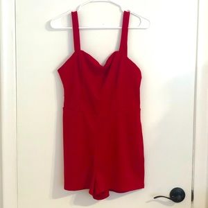 Red romper size medium. Never been worn. Brand new.